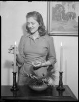 Betty Hanna lighting candles, Santa Monica, 1941