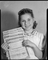 Sylvia Arslan with savings bonds, [1939-1940?]