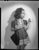 Sylvia Arslan with purse, 1937