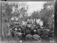 Outdoor event with flags and military veterans, [Los Angeles?],  [1949?]