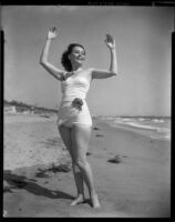 Betty Herrick [?] on beach, 1953-1964
