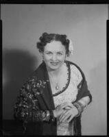 Mezzo soprano  June Moss wearing shawl and flower, 1956