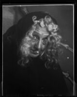 Lucille S. King, actress and ventriloquist, dressed as a witch, 1951