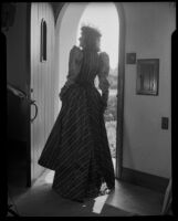 Lucille S. King, actress and ventriloquist, in the doorway of the Bartlett residence, 1951