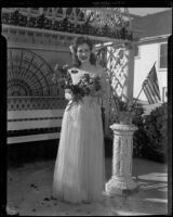 Gloria Udelle Kerruish with roses and American flags, Santa Monica, 1943-1945