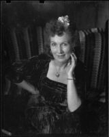 Gloria Udelle Kerruish in a velvet dress, Santa Monica, 1943-1945