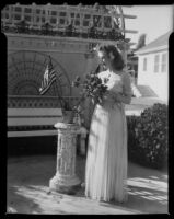 Gloria Udelle Kerruish with roses and American flags, Santa Monica, 1943-1945