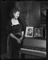 Gloria Udelle Kerruish in a velvet dress next to a piano, Santa Monica, 1943-1945