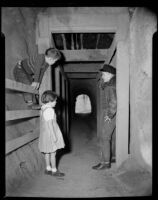 Children in tunnel, likely located under Sorrento Beach Club, Santa Monica, 1952