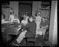 Liberace performs for veterans at the V.A. hospital, Los Angeles, circa 1952-1953