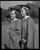 Los Angeles High School senior Nancy Lou Pederson and another senior in caps and gowns, Los Angeles, 1940