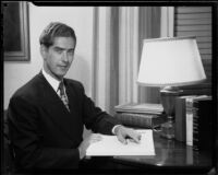 Mr. McAdam seated at a desk, 1949