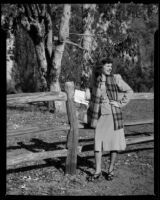 Eleanor Handy leaning on a fence, 1947