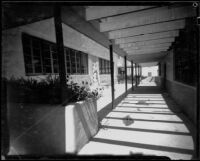 Hallway and courtyard with the Viking sculpture, Santa Monica High School, Santa Monica, 1938