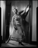 Leonora Preston posing in Southeast Asian attire, Santa Monica, 1951