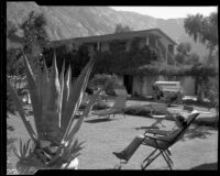 Guests relaxing in the courtyard of the Oasis Hotel, Palm Springs, 1930s