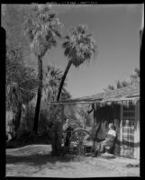 Paul P. Wilhelm and Dorie Doney at the main house at 1000 Palms Ranch, Thousand Palms vicinity, 1941