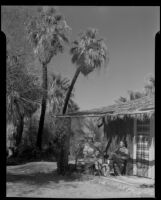 Paul P. Wilhelm and Dorie Doney at the main house at 1000 Palms Ranch, Thousand Palms vicinity, 1941
