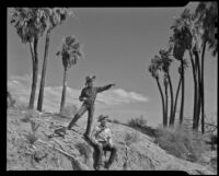 Paul P. Wilhelm and Marcella in the desert landscape at 1000 Palms Ranch, Thousand palms vicinity, 1939