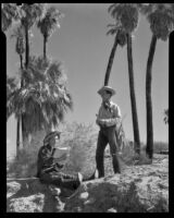Paul P. Wilhelm and Marcella against a desert backdrop at 1000 Palms Ranch, Thousand Palms vicinity, 1939