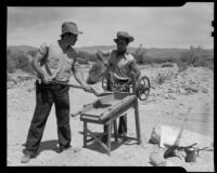 Men demonstrating gold mining equipment at 1000 Palms Ranch, Thousand Palms vicinity, 1939