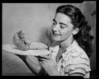 Marjorie Duggan with a tuber, Santa Monica, 1943