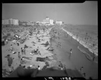 Santa Monica shoreline crowded with beachgoers, Santa Monica, 1952