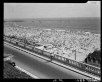 Santa Monica shoreline crowded with beachgoers seen from the California Incline, Santa Monica, 1952
