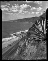 View toward lighthouse building from Palisades cliffs above Will Rogers Beach, Los Angeles, 1940-1946