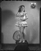 Barbara Tramutto posing in a satin costume, Santa Monica, 1948-1950