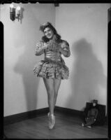 Barbara Tramutto posing in a tutu costume and pointe shoes, Santa Monica, 1948-1950