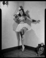 Barbara Tramutto posing in a tutu costume and pointe shoes, Santa Monica, 1948-1950
