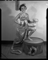 Barbara Lee Tramutto posing in Polynesian-style costume, Santa Monica, 1951