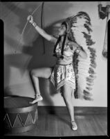 Barbara Lee Tramutto in Indian-style costume with bow, Santa Monica, 1951