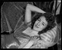 Sue Ackerman Monkman lying on pillow, 1945