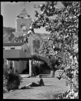 Woman seated on lawn, El Mirador Hotel, Palm Springs, 1935