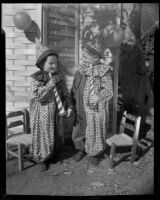 Carl Farnham and Paul Farnham in clown costumes, [Santa Monica?], 1951