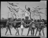 Salt Water Carnival Queen tops a pyramid of swimmers at the Salt Water Carnival, Santa Monica Beach, 1940