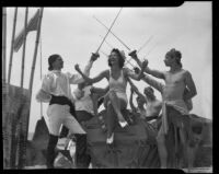 Salt Water Carnival Queen seated under vaulted swords, Salt Water Carnival, Santa Monica Beach, 1940