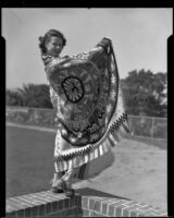 Santa Monica College student modeling a woven blanket, Santa Monica, 1937