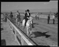 Equestrians and judges participating in a horse show at the Palm Springs Field Club, Palm Springs, 1937