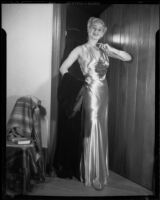 Ruth Crandall modeling a satin evening gown, Santa Monica, circa 1955