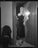 Ruth Crandall modelling a cocktail dress, Santa Monica, circa 1955