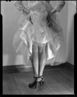 Ruth Crandall modeling a lade and organza evening gown, Santa Monica, circa 1955