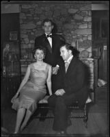 Betty Herrick with 2 unidentified men in a living room, 1955