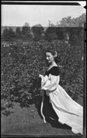 Photograph of Betty Herrick with roses, 1950s