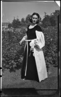 Photograph of Betty Herrick with roses, 1950s