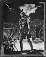 Actor in costume as a centurion standing outside the tomb of Christ in a Sunday Players program, circa 1935
