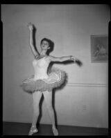 Girl, Suzi Klein (?), posed in a leotard, tutu and pointe shoes