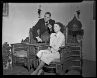 Man and woman in a room with Egyptian furnishings, Santa Monica, 1950